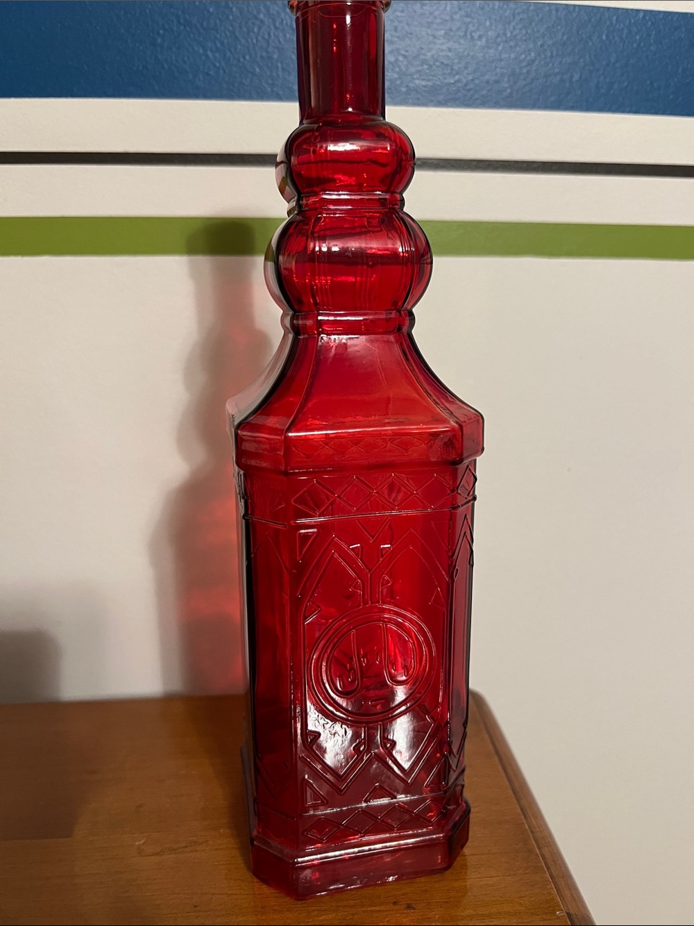Vintage Ruby Red Embossed Glass Bottle
Tall 11.75”
